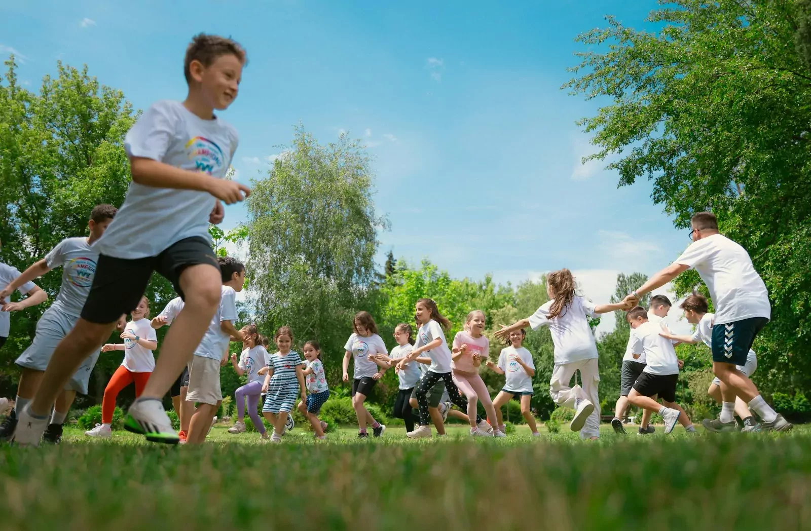 a group of young people playing a game of frisbee